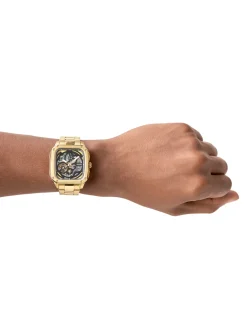 Montre Fossil automatique Inscription acier dore